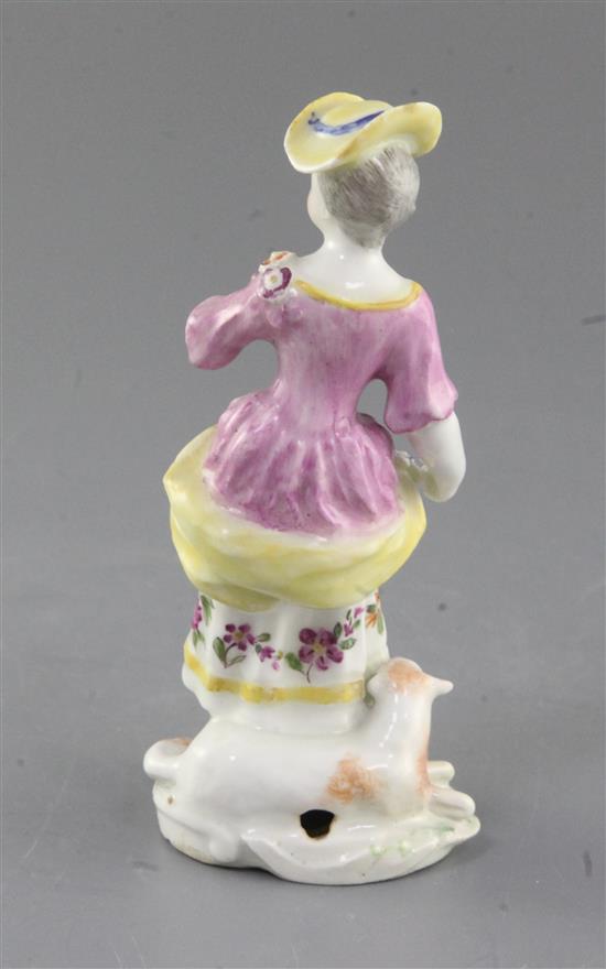 A Derby figure of a shepherdess, c.1760, h. 14cm, left wrist, hat brim and sheep front legs restored